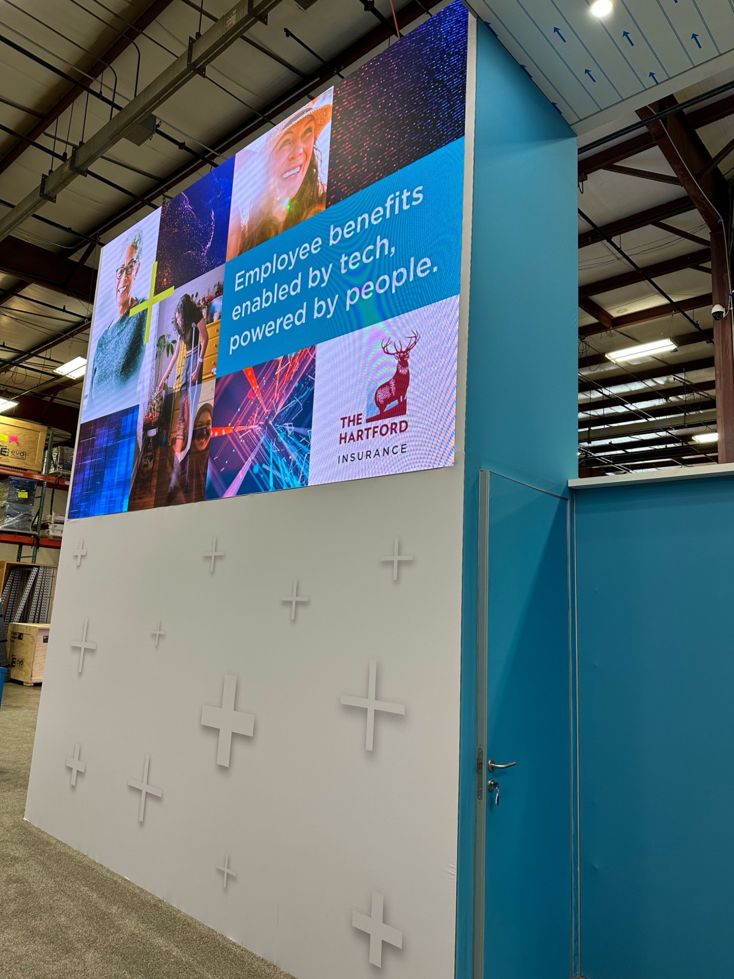 The opposite side of a tall Hartford event display with imagery and brand messaging